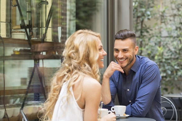 Beautiful couple having coffee on a date - The Gemini Man Romance Guide