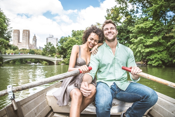 Happy couple having fun on a boat in Central Park - What is the best way to tell your Gemini man you’re falling for him