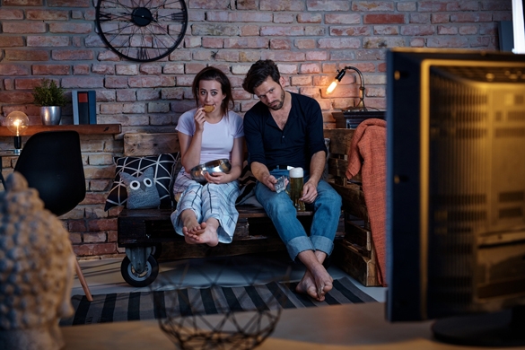 Young couple sitting at home on pallet furniture - What Are The Gemini Man's Bad Habits